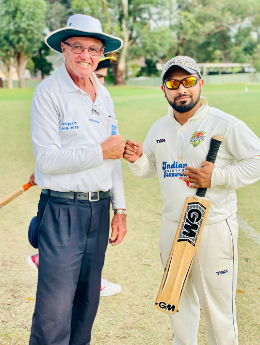 Sydney Chargers player with an umpire after the match