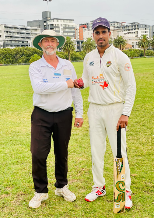 Sydney Chargers player receiving the match ball from an umpire